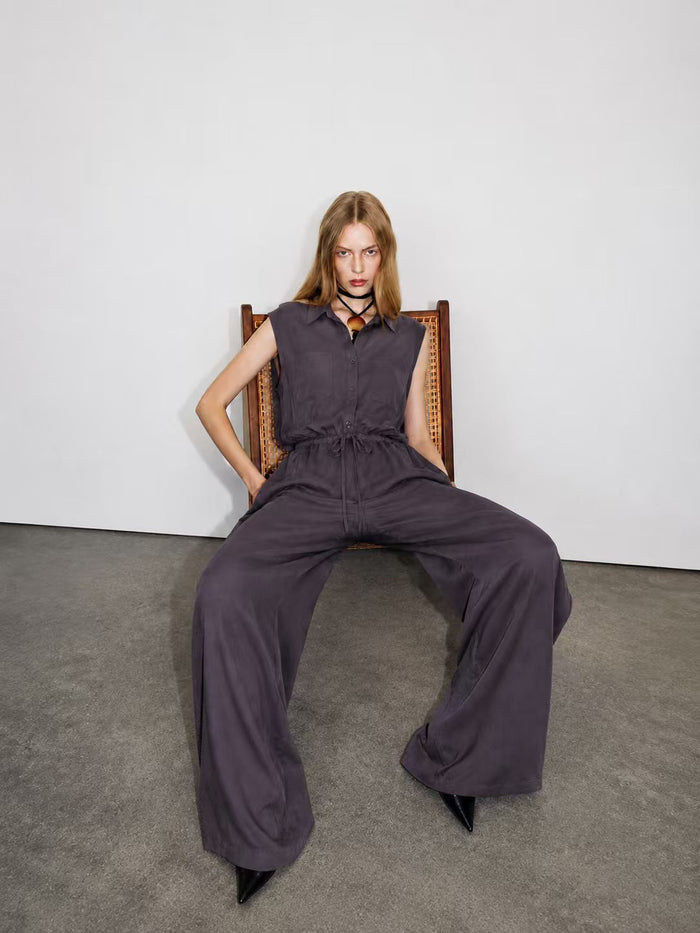 Woman modeling charcoal purple sleeveless shirt and wide leg pants co-ord set