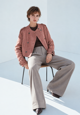 Woman modeling dusty rose cropped double breasted jacket