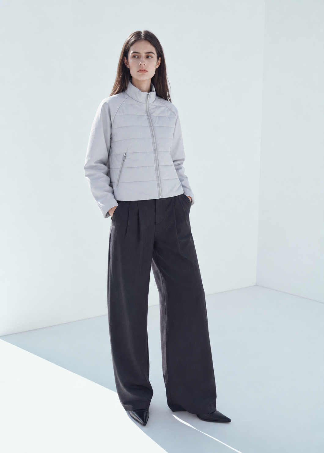 Woman modeling white quilted front knit sleeve zip jacket