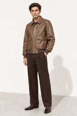Man modeling brown faux leather collar bomber jacket