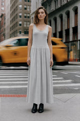 Woman modeling grey sleeveless drop waist maxi dress