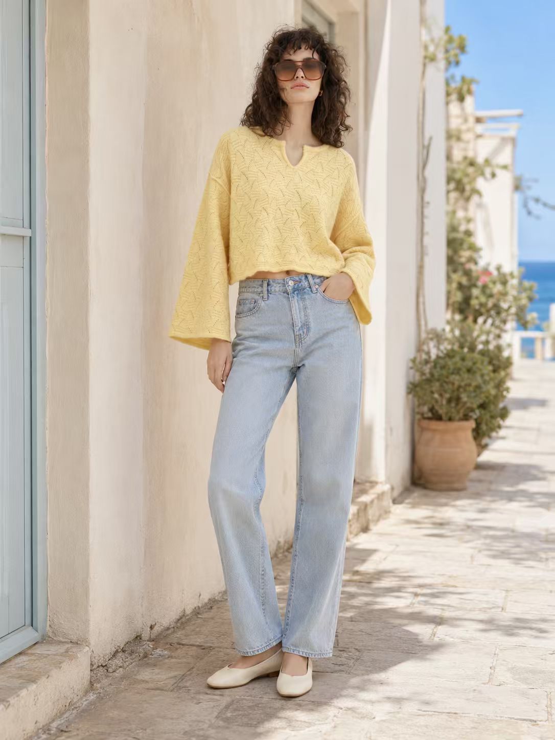 Woman modeling sunshine yellow openwork knit cropped sweater