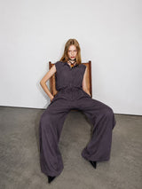 Woman modeling charcoal purple sleeveless shirt and wide leg pants co-ord set
