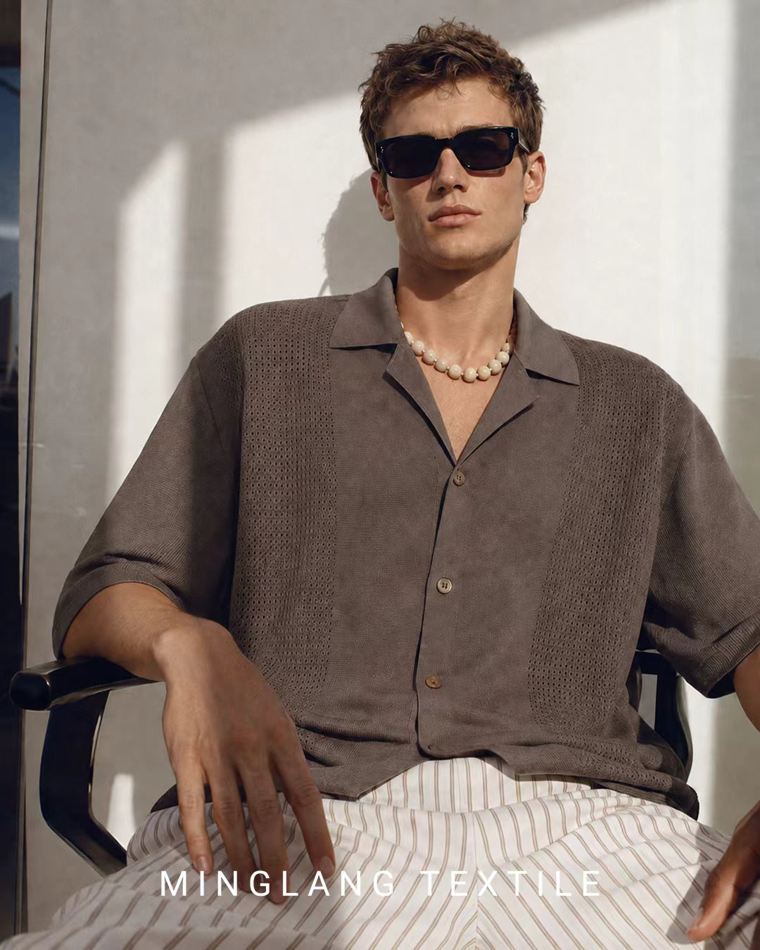Man modeling mocha brown relaxed collar knit short sleeve shirt