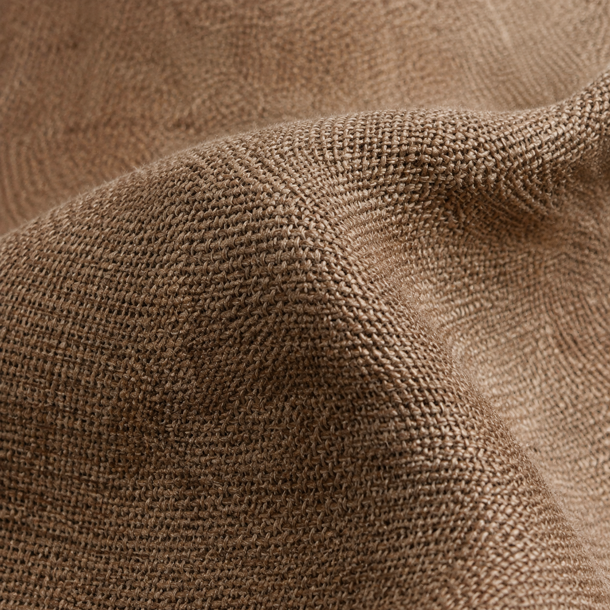 Taupe brown woven fabric with a soft fold