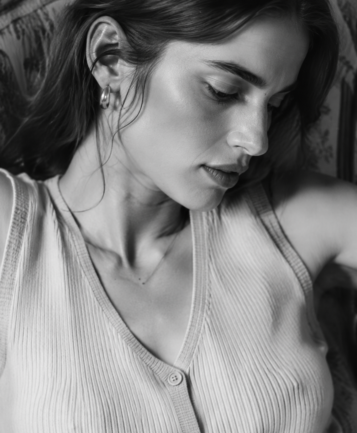 Black and white portrait showing the texture of an ivory knit vest
